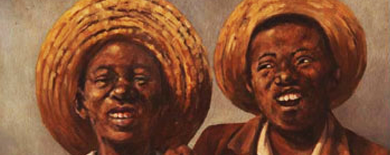 Imagem mostra dois homens negros com chapéus de palha na cabeça